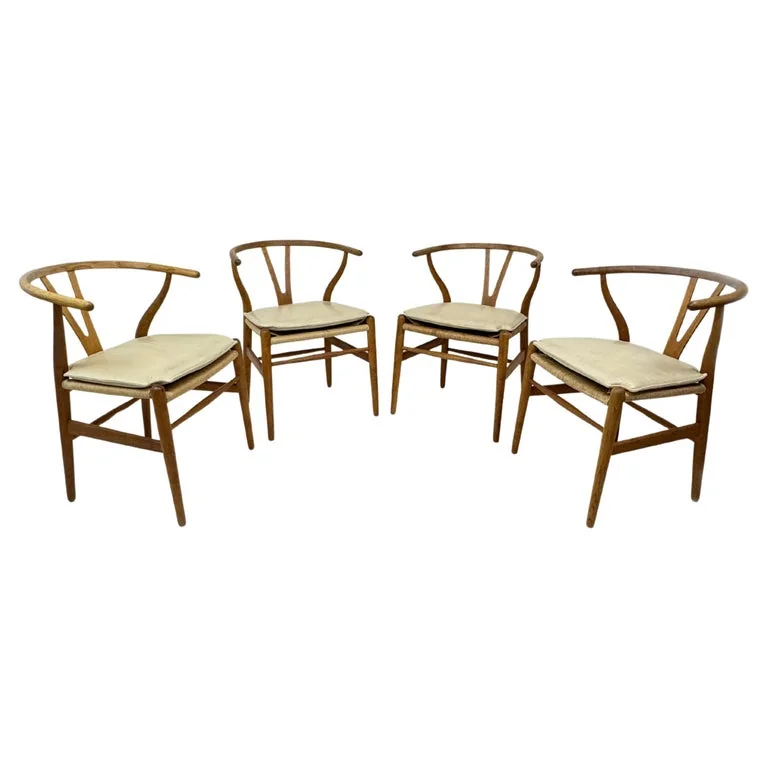 Set of Hans J Wegner CH24 Wishbone dining chairs in patinated oak