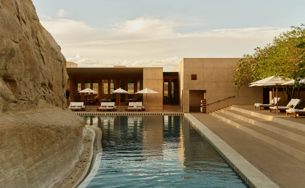 Amangiri resort pool nestled beside desert rock in Utah