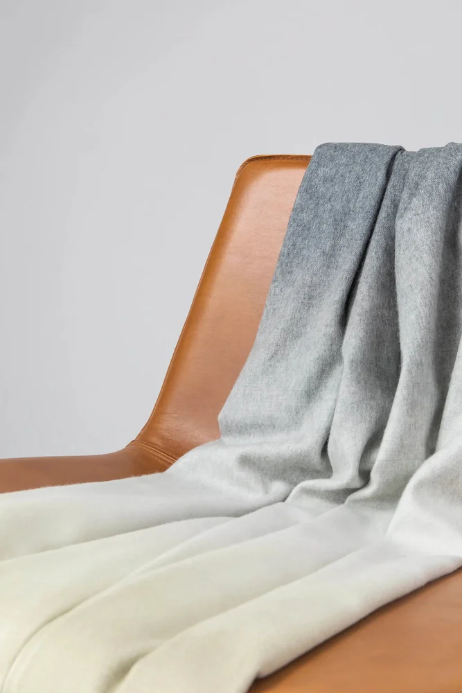 Johnstons of Elgin cashmere throw; olive and grey ombré version shown.