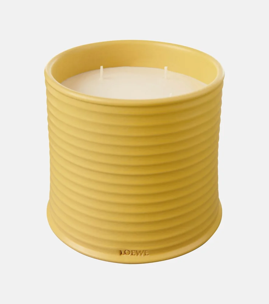 Loewe Home Scents large Honeysuckle candle in a yellow ribbed terracotta vessel.