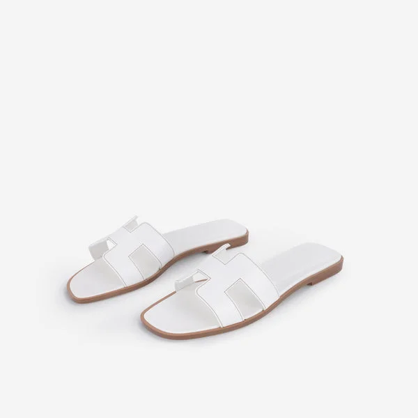 Hermès Oran sandals in white calfskin.
