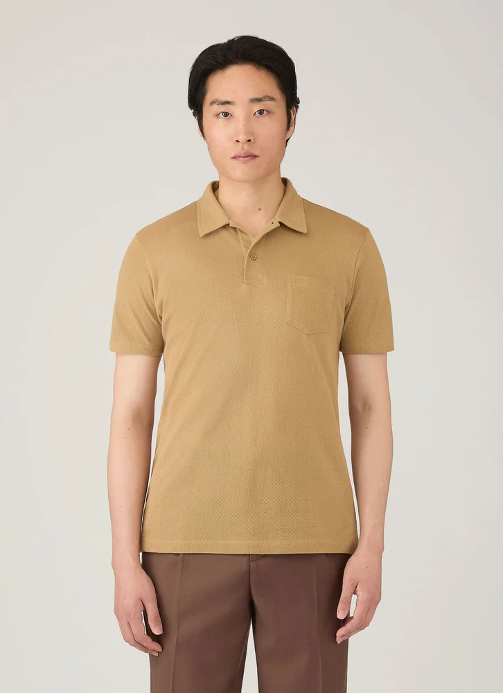 Sunspel Riviera cotton mesh polo shirt in tan; representative of the Riviera knit family.